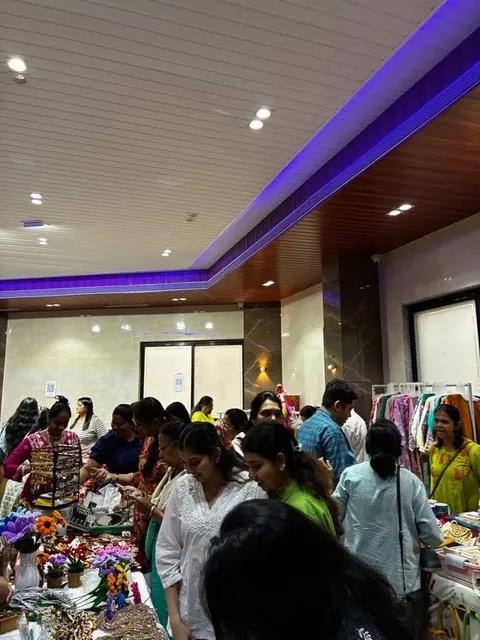 Shoppers browsing decorated stalls at a festive exhibition organised by Mega Events
